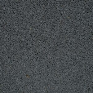 Detailed view of a gray synthetic doormat showcasing its fiber texture.