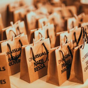 Close-up of eco-friendly paper bags with rope handles, ideal for events and packaging.