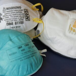 Assorted N95 and surgical masks for respiratory protection against harmful particles.